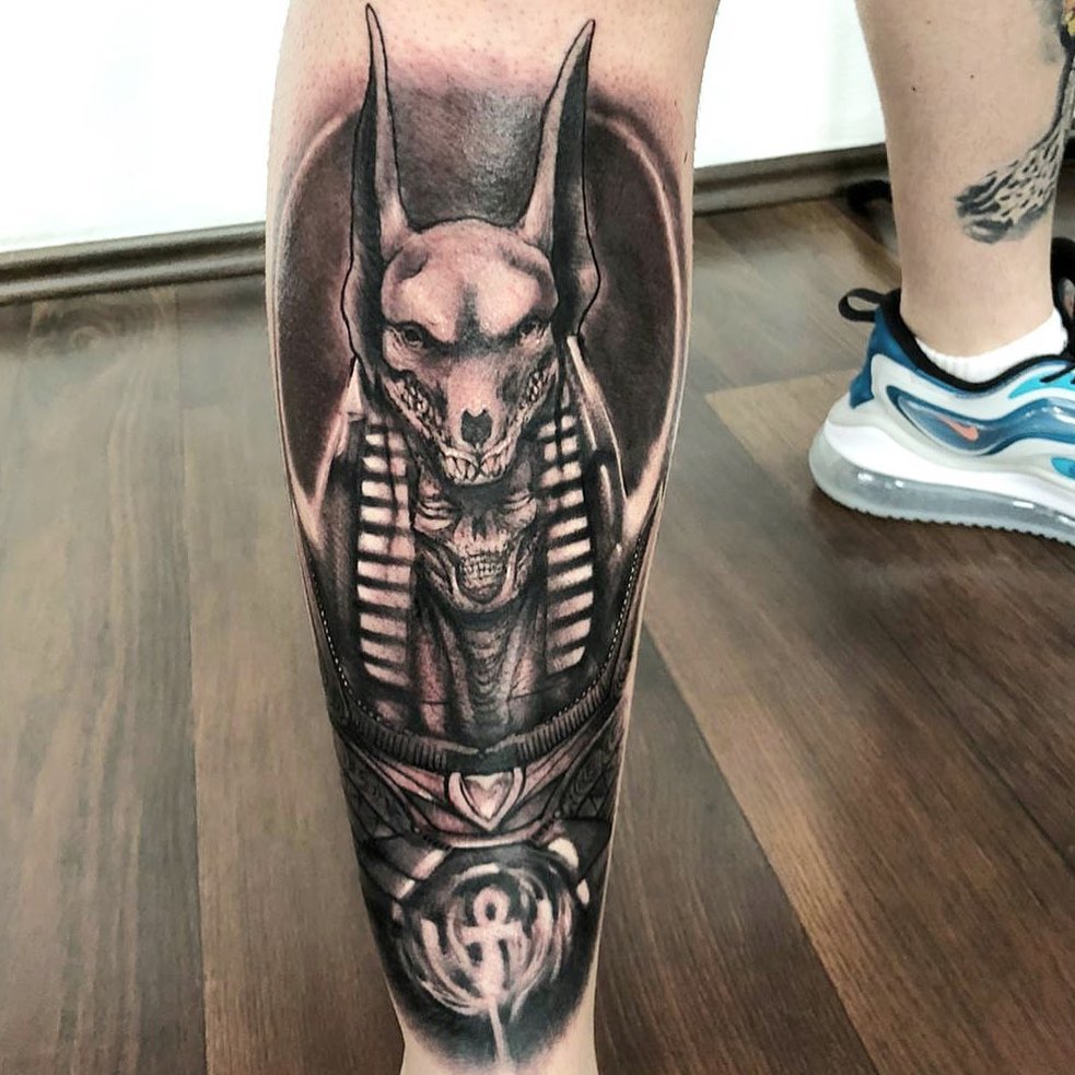 Combine your Anubis tattoo with another death figure for one sick tattoo.
