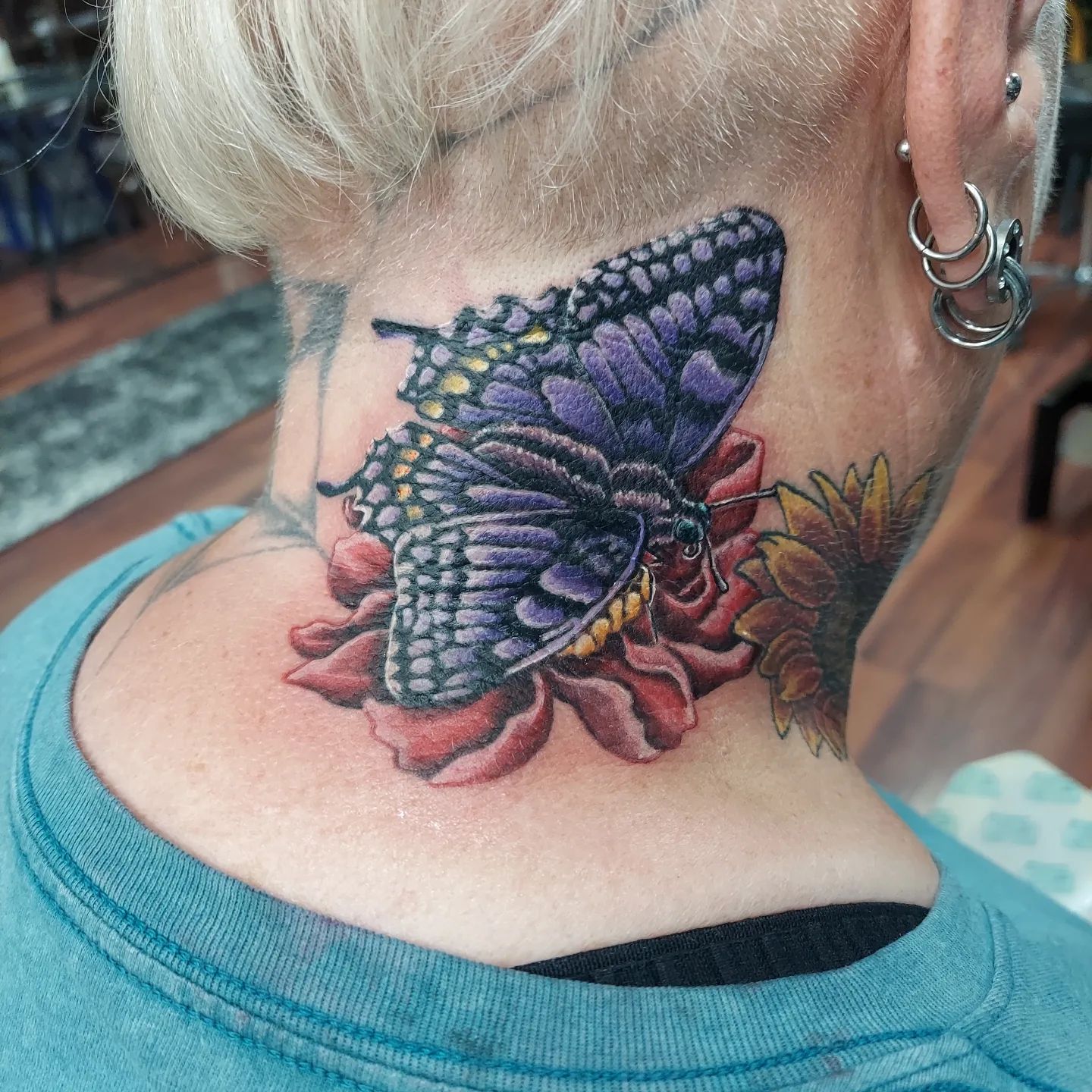  A neck tattoo of elegant purple butterfly. There is no doubt that you are going to stand out with this detailed art piece everywhere.