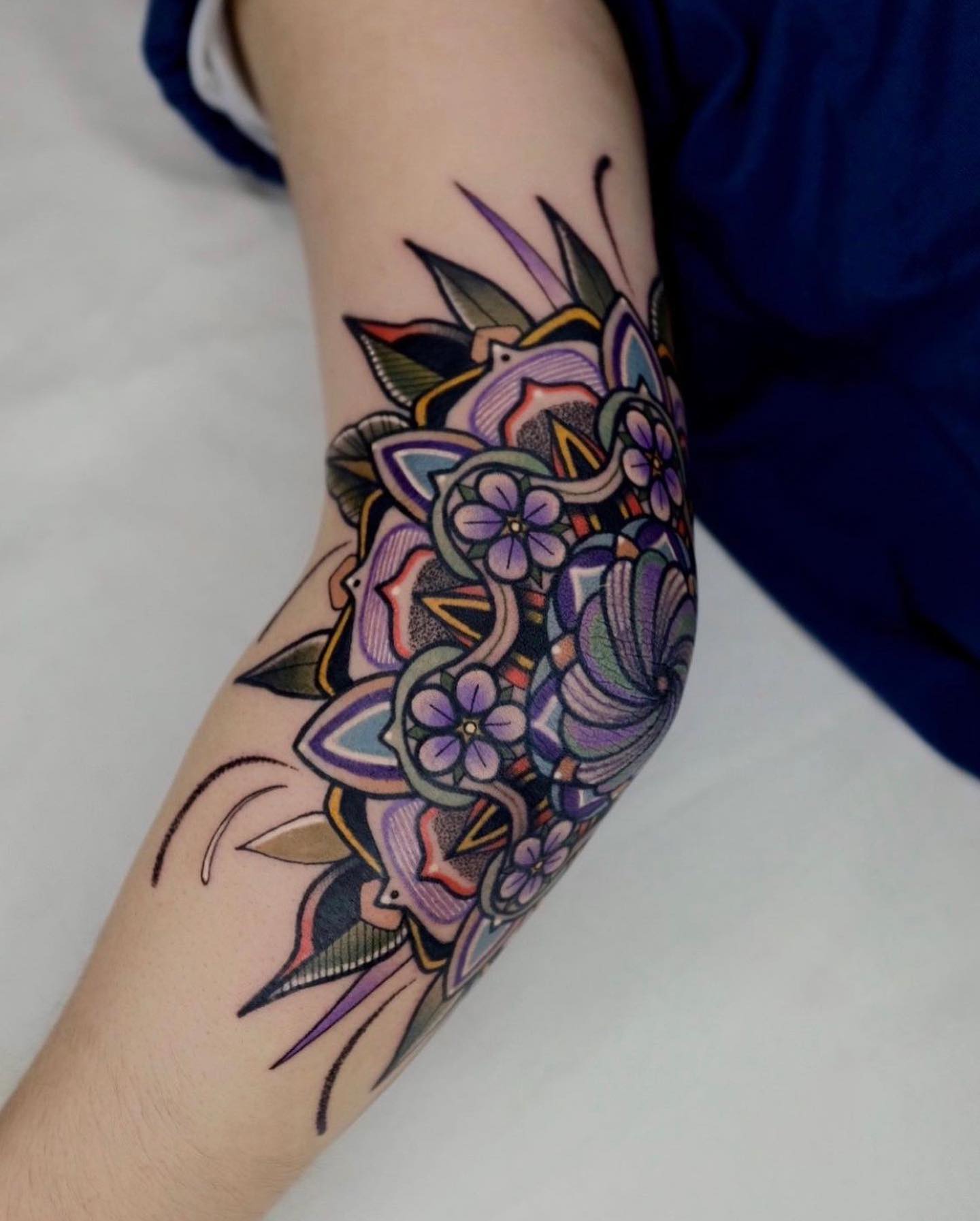 Some guys really and truly love flowers. Are you one of them? If so, this elbow tattoo will describe your character. Add a pop of purple and show that you’re someone who likes the art and that you know how to appreciate gorgeous ideas, as well as larger concepts.