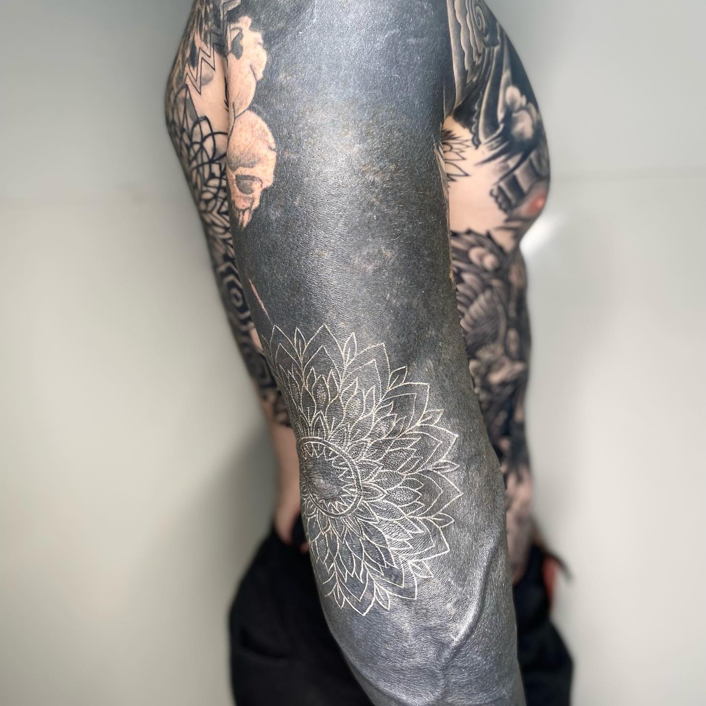 This type of giant elbow tattoo with black lines and faded artwork will look great on those who wish to stand out. As they fade these tattoos tend to look even better, so you’ll be in luck.