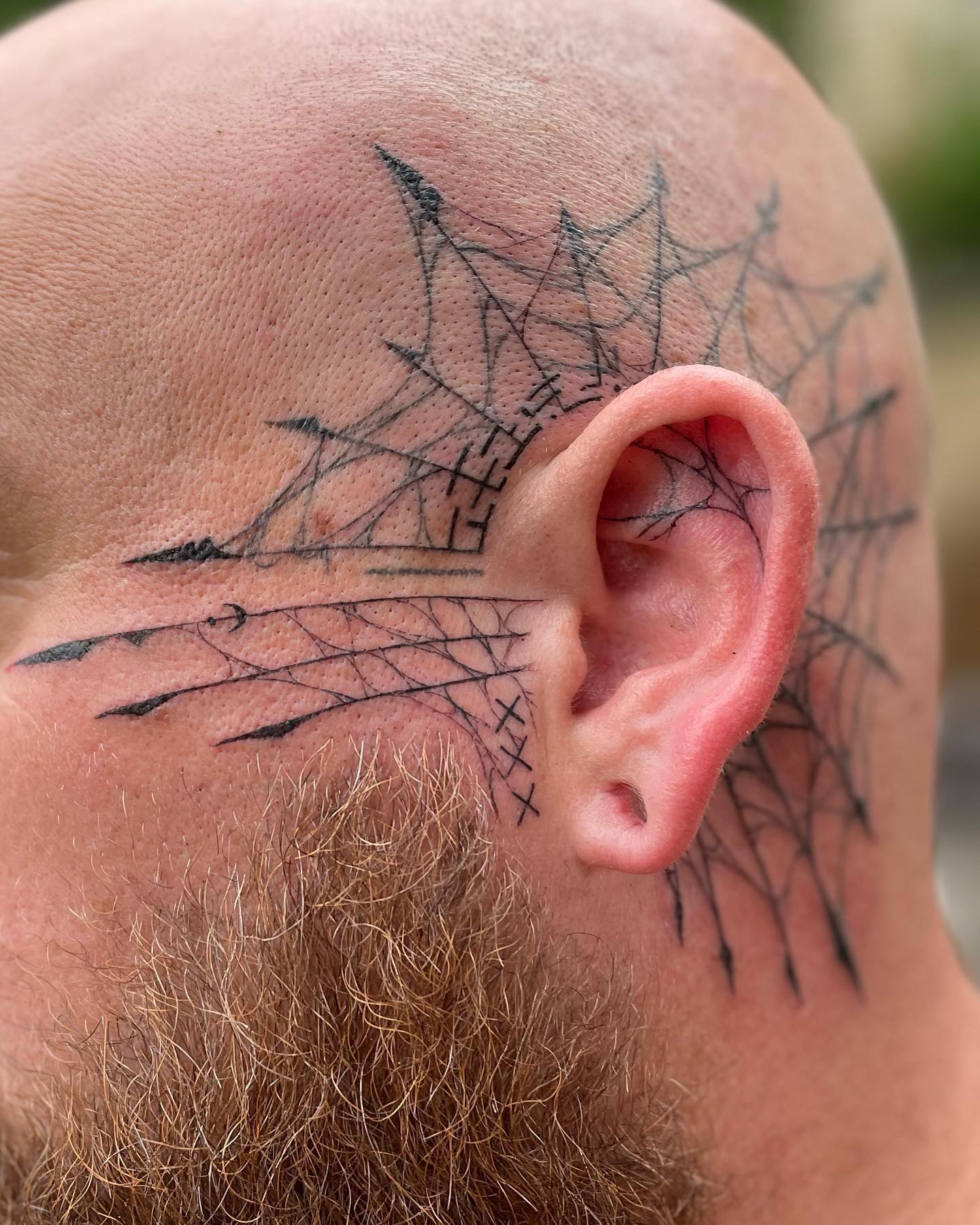 Not a lot of guys dare to try out a head tattoo. Do you? If so, give it a go with this marvelous piece.