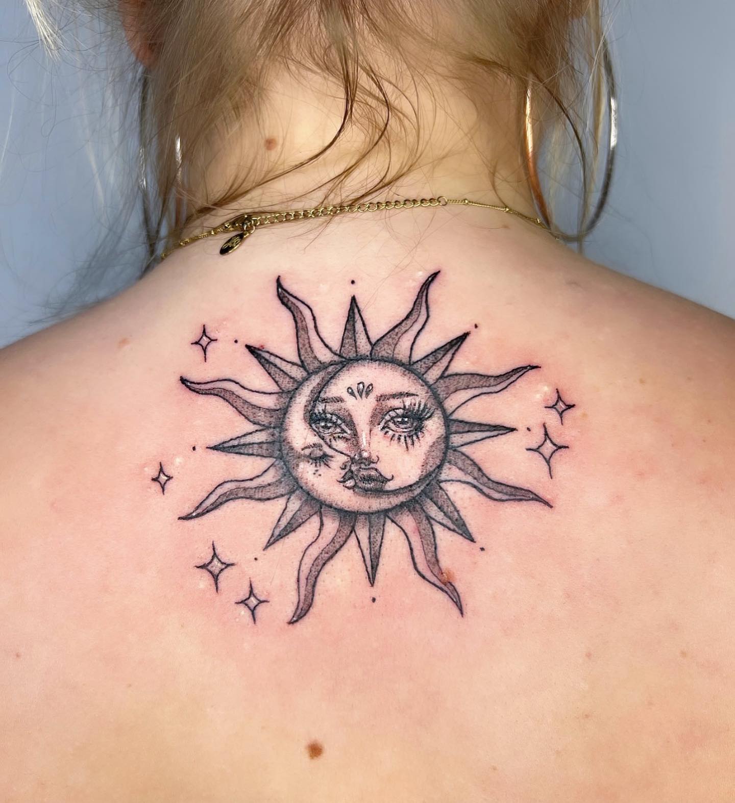 The sun tattoo over your back will symbolize your inner warmth and bright personality.