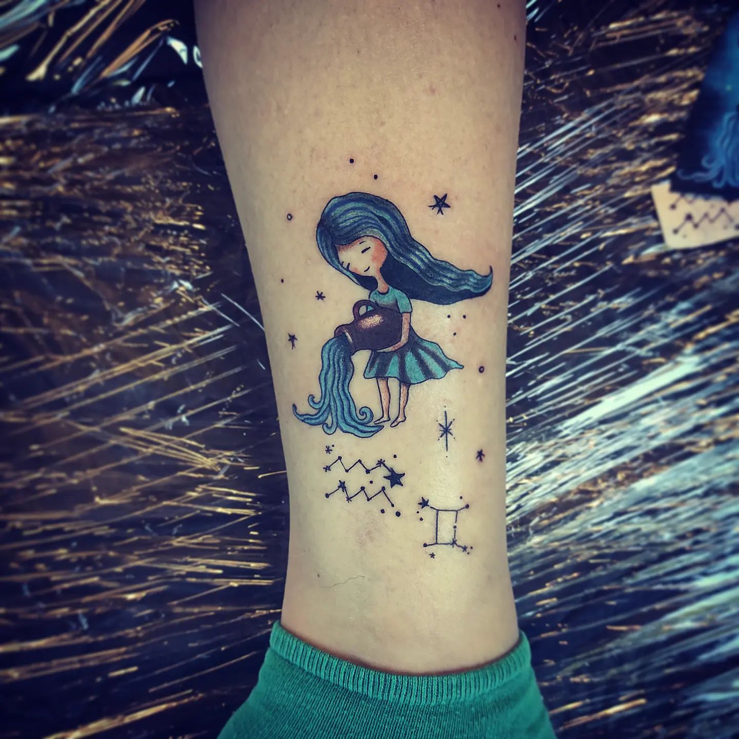Fairy tattoos often used as symbols of nature and childhood innocence. If you are a girl who is fond of fairies, this little fairy aquarius tattoo is waiting for you to make you stand out.