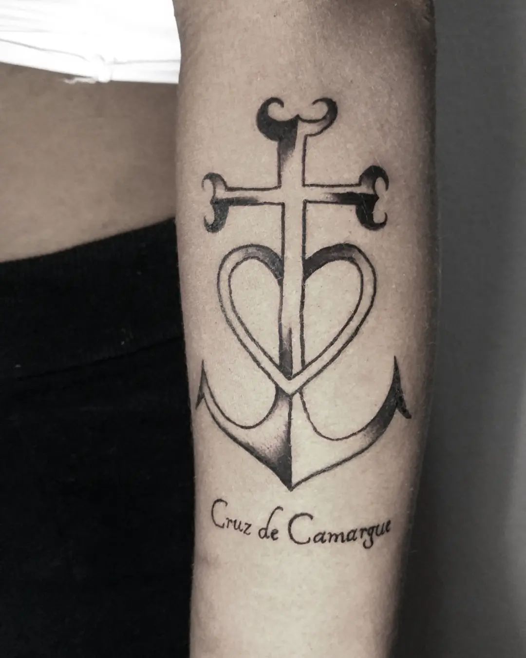 Cross of Camargue is a symbol which is created with an anchor and a cross. It represents the most important three values of humanity, which are hope, faith and love. These powerful meanings it carries make this symbol great. Let's cover your arm with it.