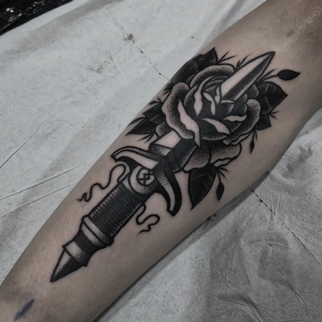 Rose & Dagger tattoo is always a popular choice among people who like classics. Consider to get this dotwork tattoo if you are one of them.