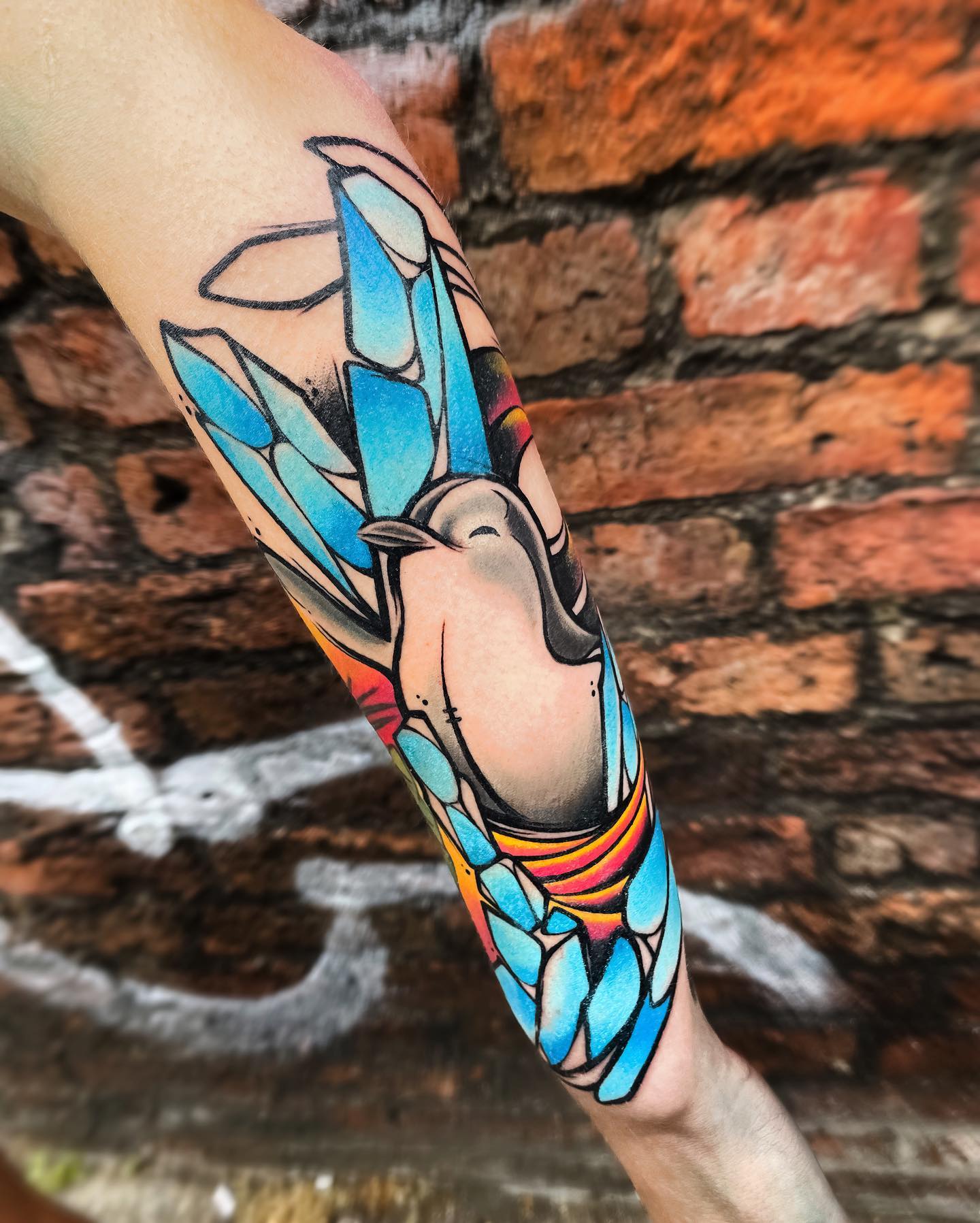 The penguin breaks the ice with its warming heart in this tattoo. Bright and colorful inks allow this tattoo to shine out in the crowd.