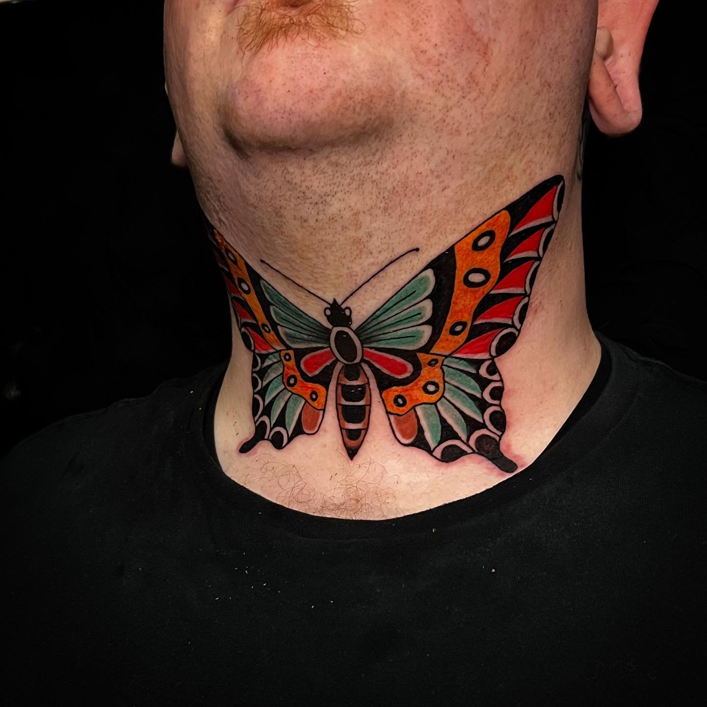 A colorful  tattoo that is as vivid as a butterfly is waiting for you. The combination of colors, perfectly done lines and the symmetry of design create a pure art. So, don't hesitate to get a pure art on your throat and give a shot to this tattoo.