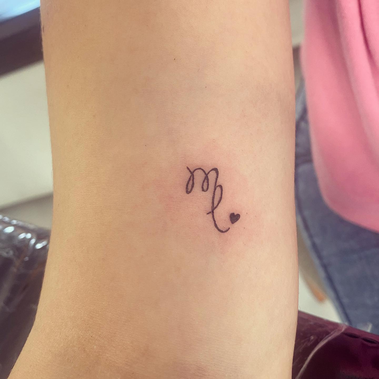 If you don't like big tattoos that cover your body, here is a perfect tattoo for you. This adorable small Virgo tattoo will suit on you.