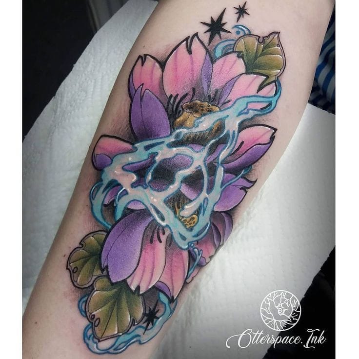 Pink and purple color combo is amazing, isn't it? In a purple and pink lily tattoo, the design is meant to symbolize the union of two people. In order to commemorate your love for your partner, you can get this tattoo.
