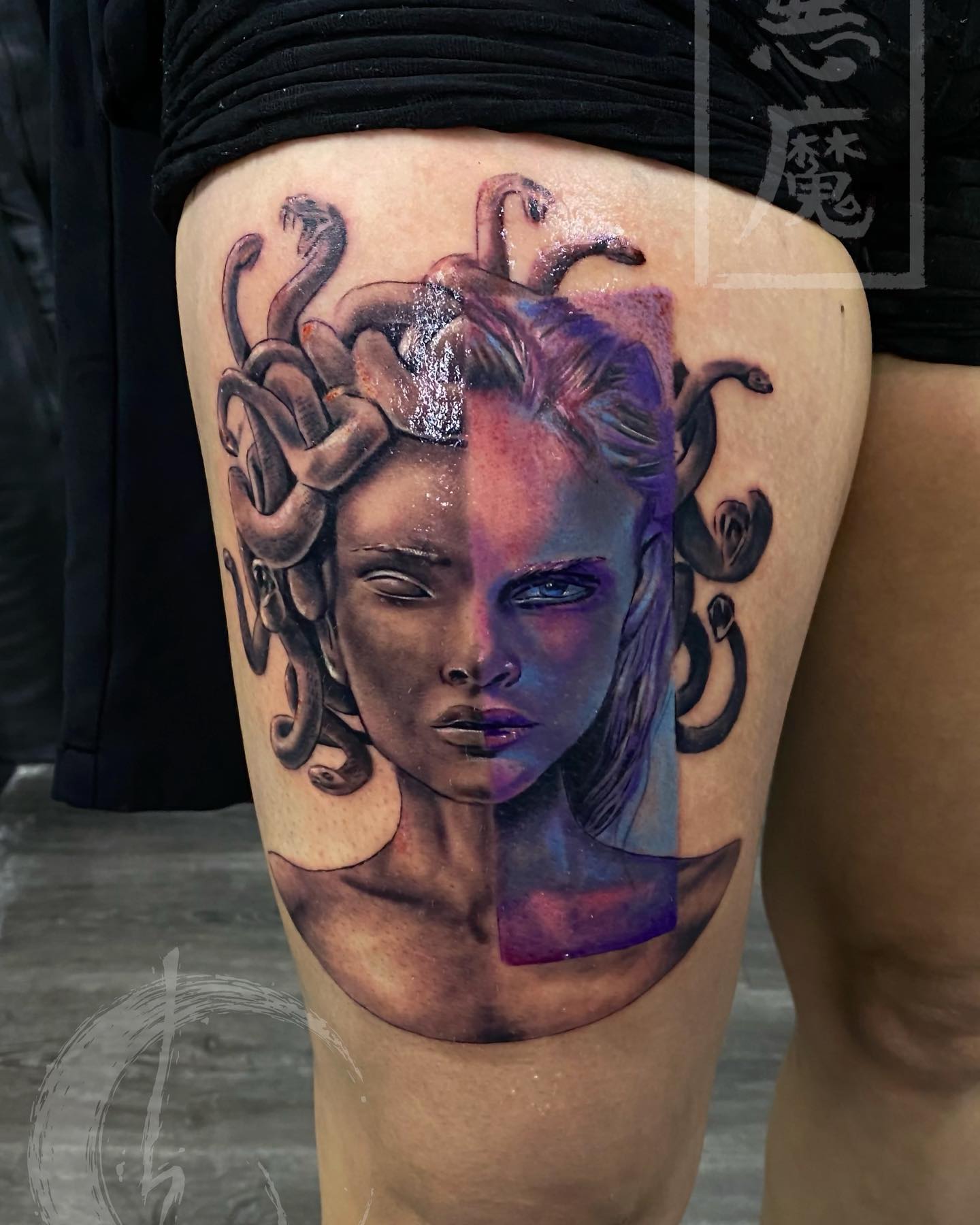 Two-faced tattoos show different sides and characteristics of people. Let's show two faces of Medusa with a black realistic tattoo on which a purple line is used to show gorgeous version of her.